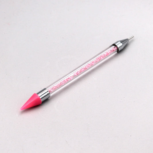 Pincel con puntero de silicona para recoger las piedras de decoración y nail art.